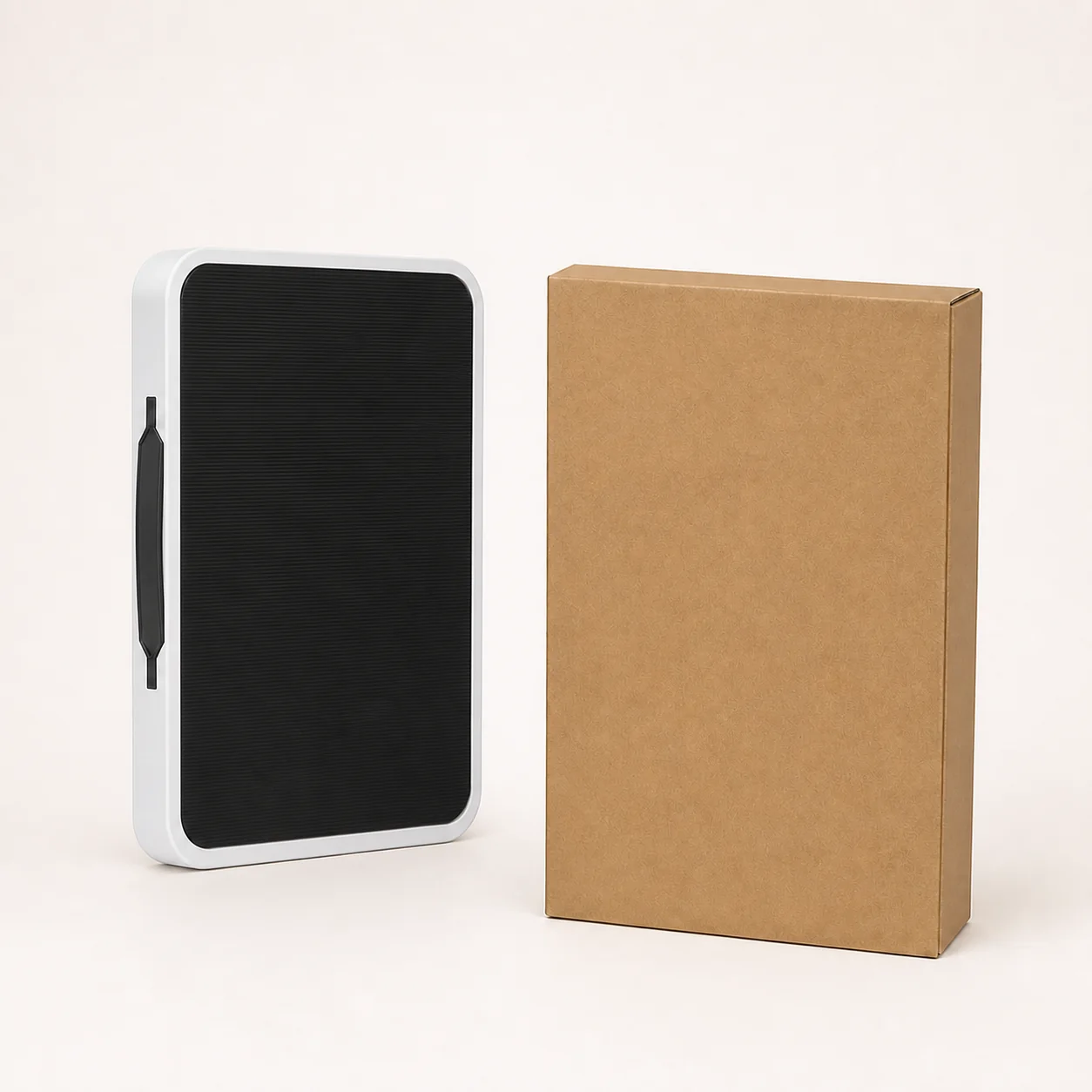 W38S fully folded adjustable work platform beside a slim kraft shipping carton